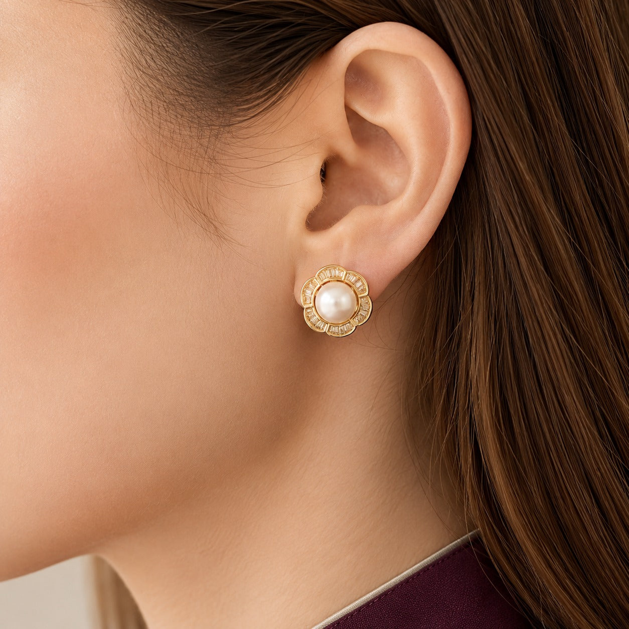 model wearing Floral pearl stud earrings featuring a luminous centre pearl surrounded by clear