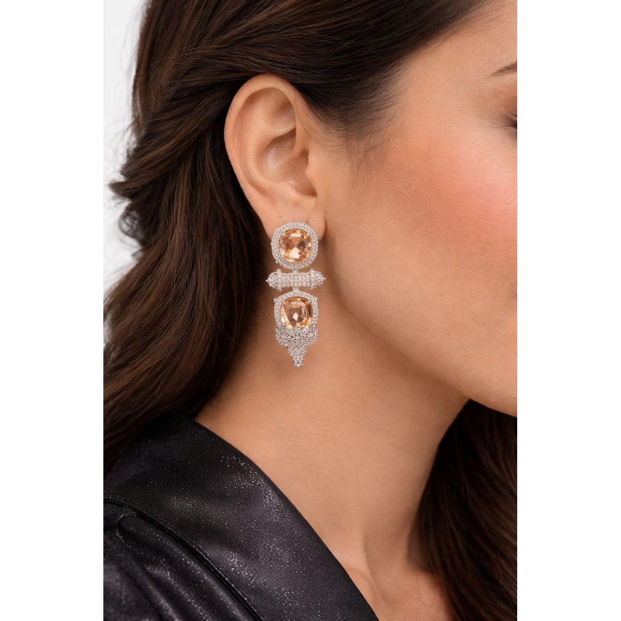 Woman wearing champagne blush cushion-cut luxury statement drop earrings in silver-tone finish