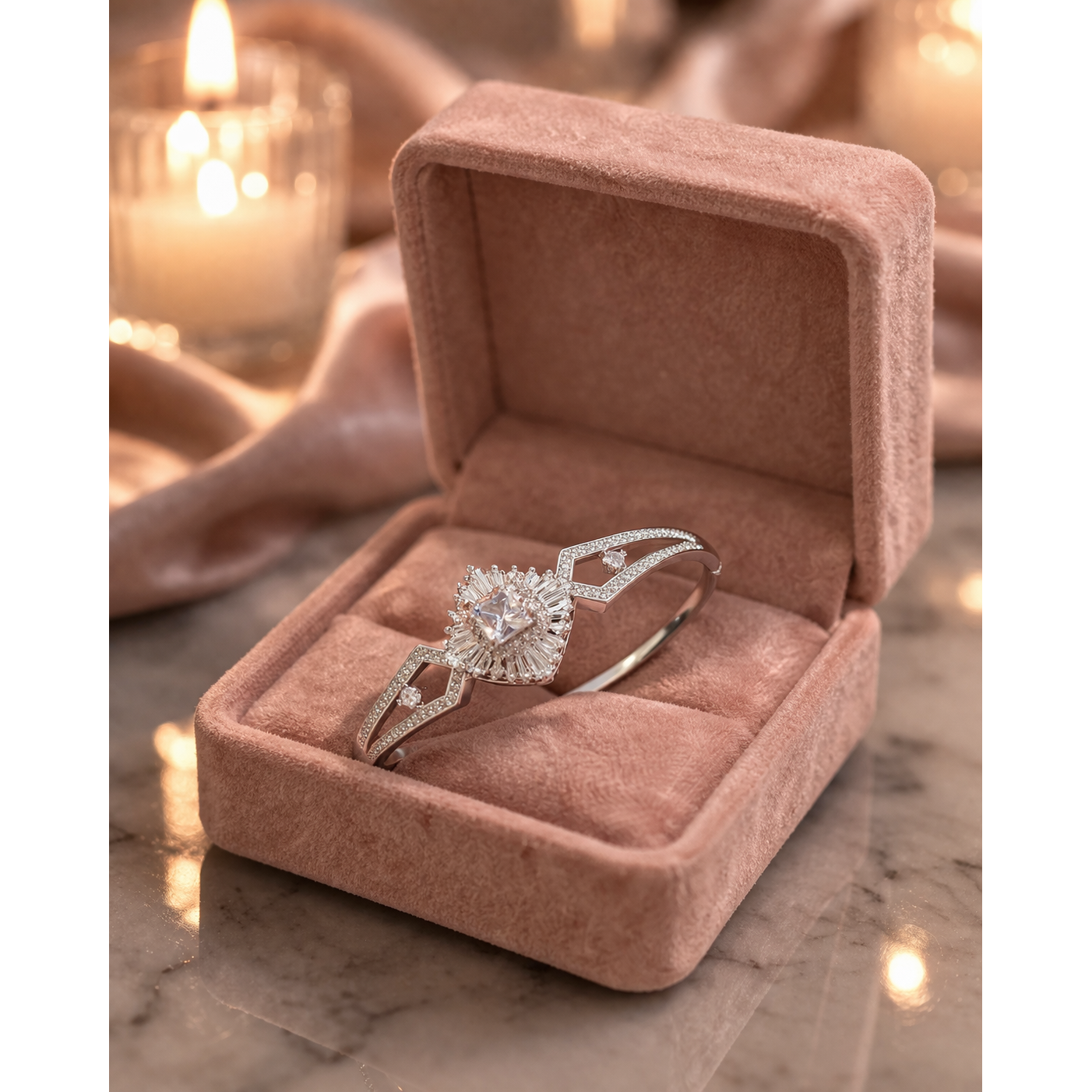 Silver crystal bracelet with lock placed in soft pink velvet jewelry box on marble surface with warm candle background