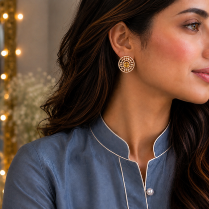  A model wearing  Solstice Studs with golden yellow oval centre stone, marquise zircon accents 