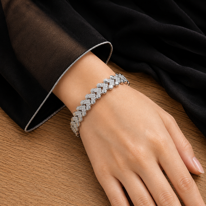 Riven Link bracelet worn on the wrist, showing alternating polished silver-tone and zircon-set geometric links.
