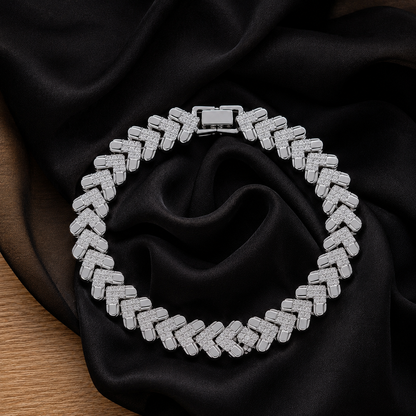 Riven Link silver-tone bracelet arranged in a circular display, featuring interlocking geometric links with clear zircon detailing
