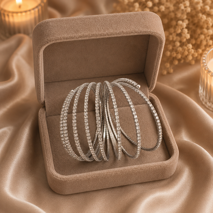 Flexible crystal bracelet shown in its expanded spring form inside a premium taupe velvet jewelry box.