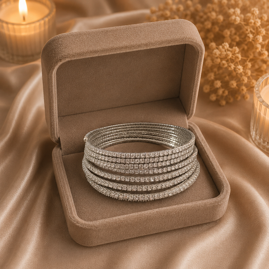 Sparkling multi-row crystal bracelet arranged in a layered profile inside a luxury velvet presentation box.