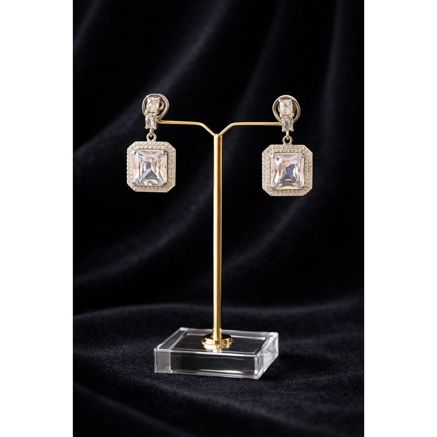 Silver crystal square drop earrings on jewellery stand, geometric frame design, fashion earrings product shot