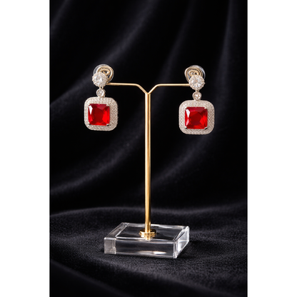 Silver square red gemstone earrings on stand, high-definition product display, modern drop design