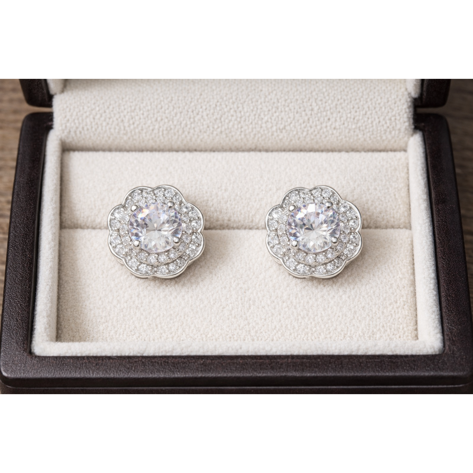 Silver floral halo clear crystal stud earrings displayed in premium cream jewellery box