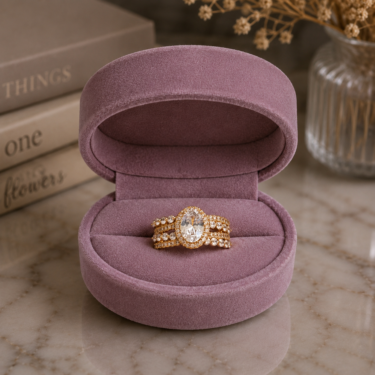 Gold-tone oval halo zircon statement ring displayed inside a luxurious mauve velvet jewellery box.