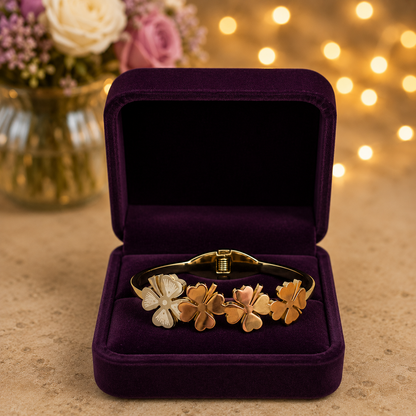 Premium gold clover bracelet highlighting the front magnetic lock and polished four-leaf clover detailing.