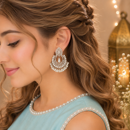 Model wearing silver zircon pearl halo drop earrings side profile