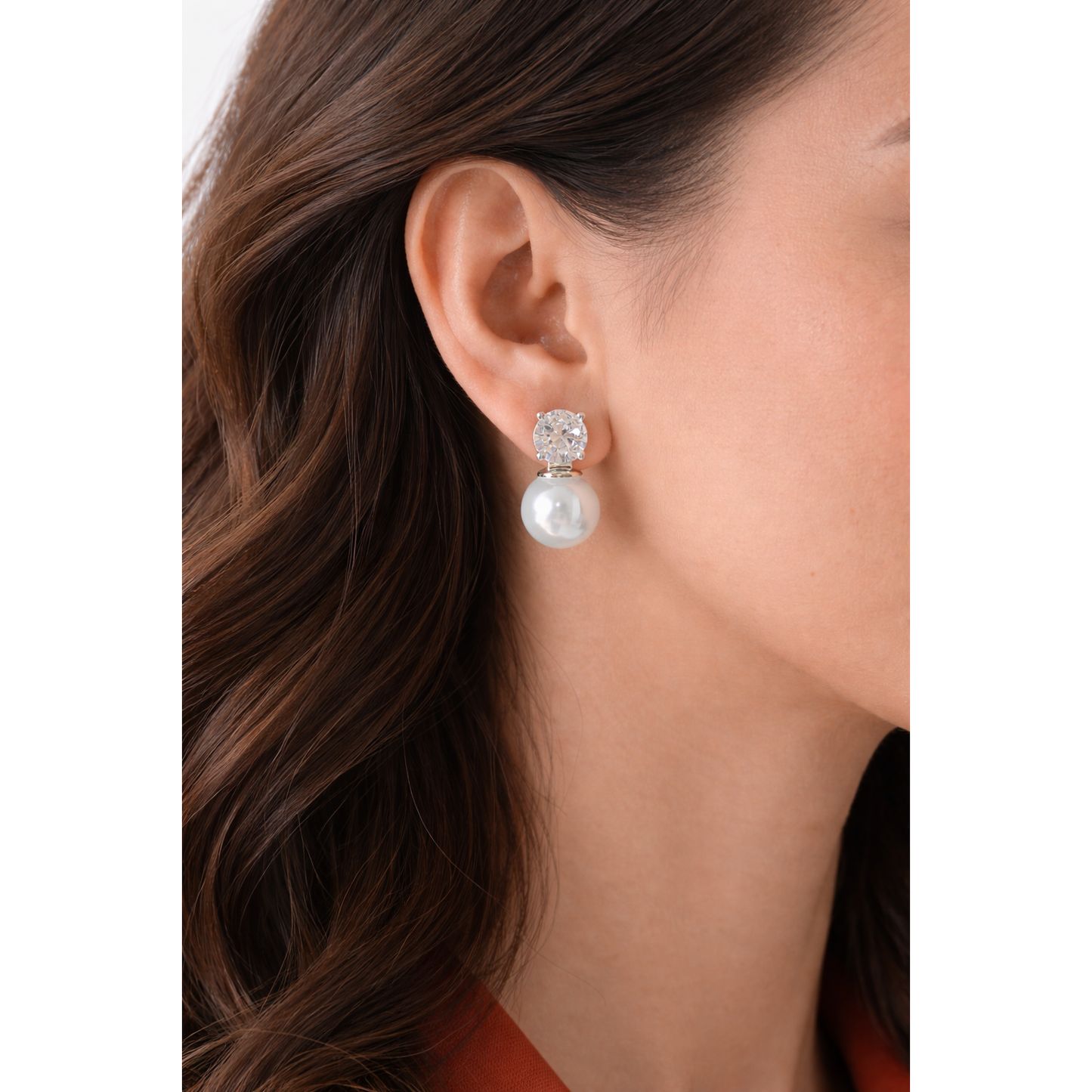 Woman wearing silver pearl and zircon drop earrings close-up showing natural drop length and silver setting