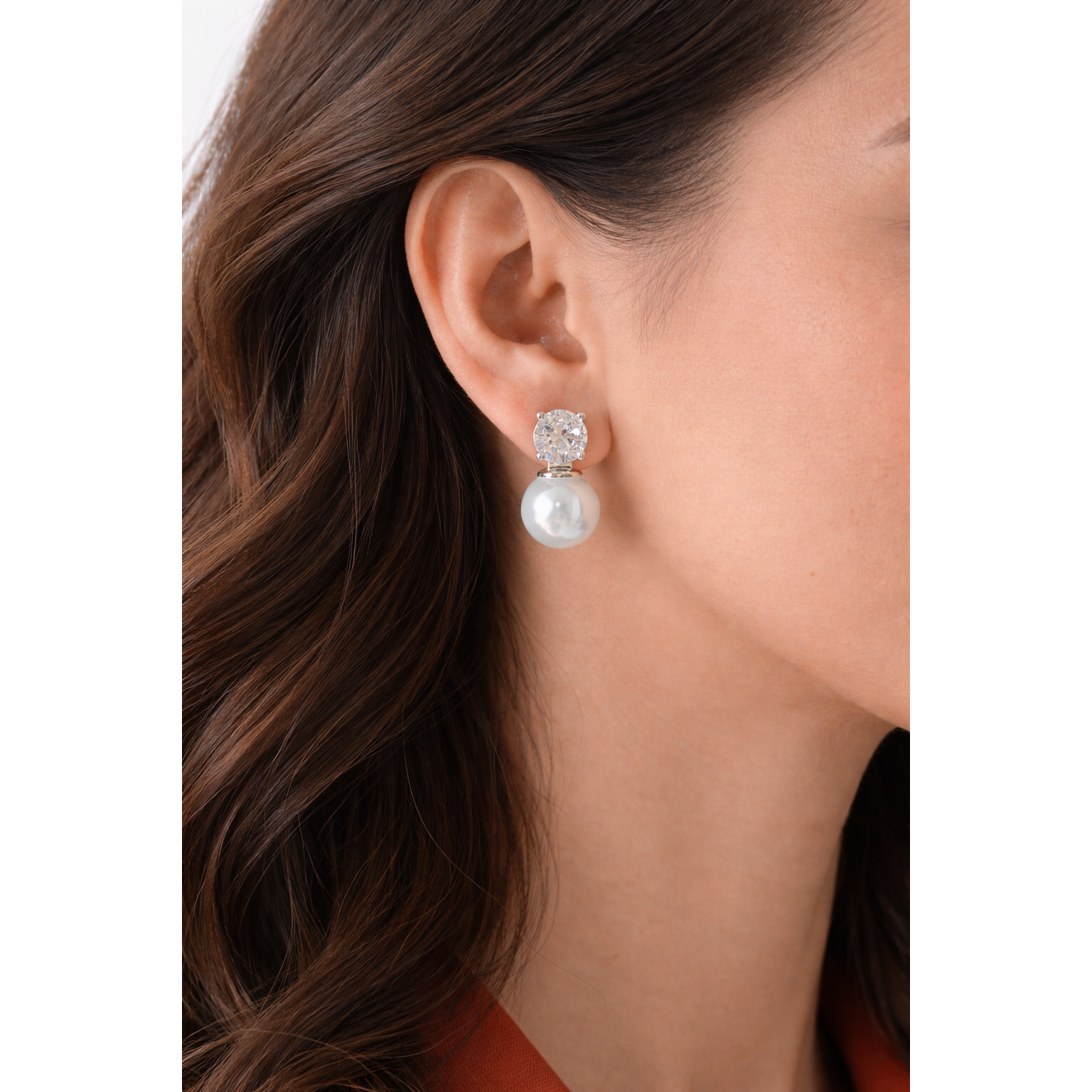 Woman wearing silver pearl and zircon drop earrings close-up showing natural drop length and silver setting