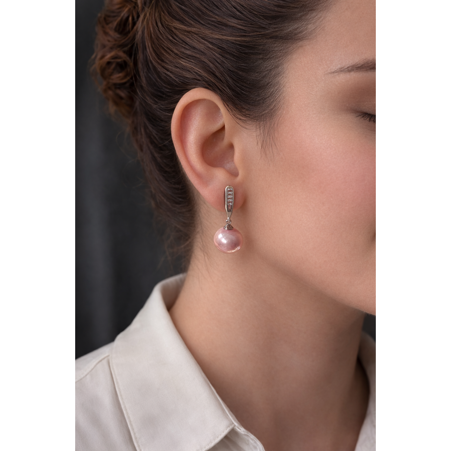 Sliver crystal bar drop earrings with light pink pearl worn on model, side profile jewellery close-up in high definition