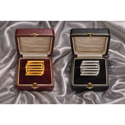 Gold and silver multi-row pavé bar rings presented side by side in luxury jewelry boxes.