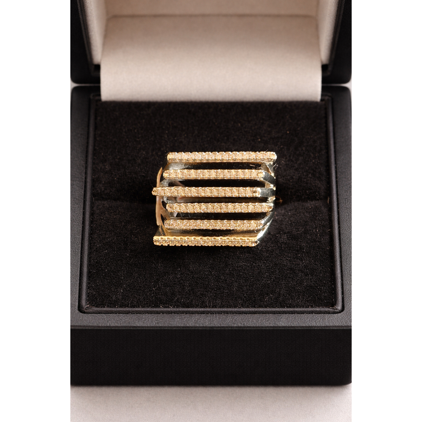 Silver multi-row pavé bar ring displayed in a jewelry box, high-definition studio shot