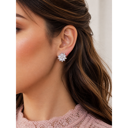 Floral crystal stud earrings worn on ear showcasing petal design with zircon stones and soft sparkle