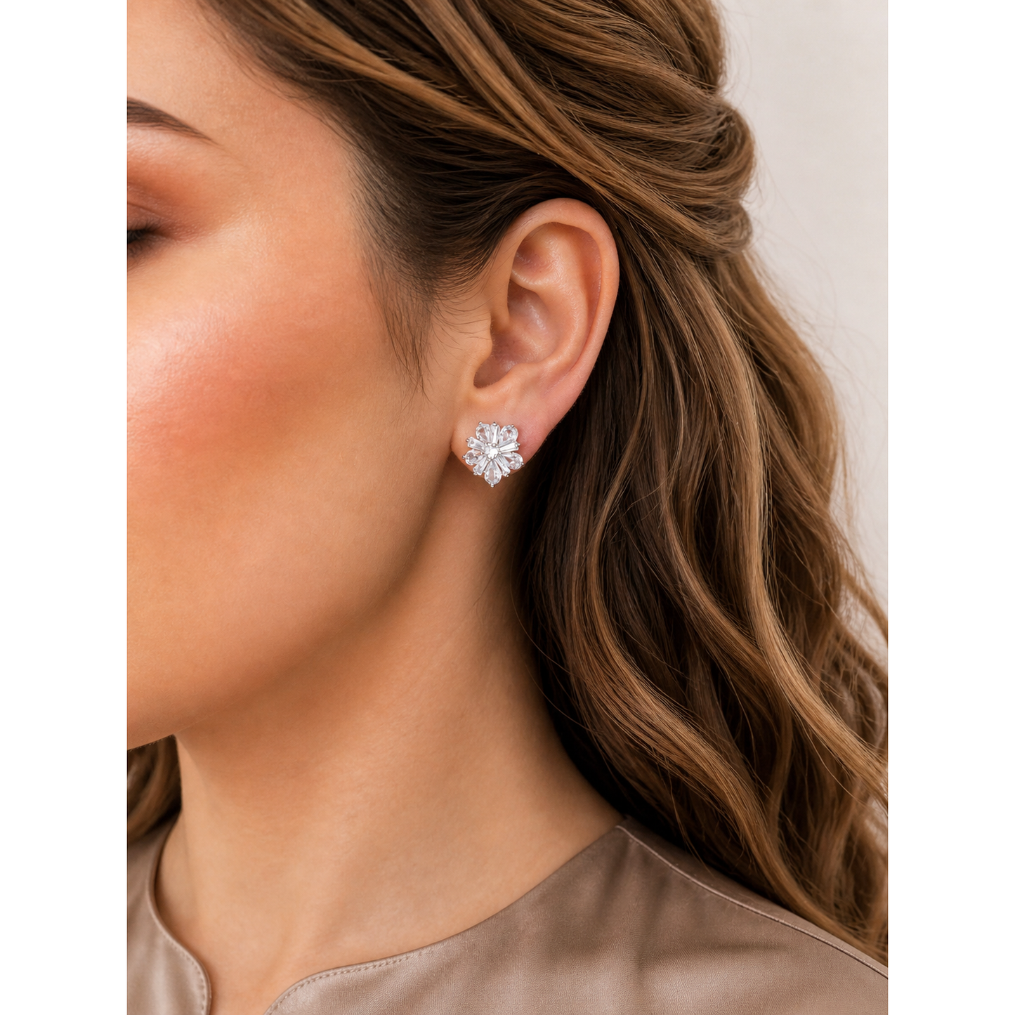 Floral crystal clip-on stud earrings worn on ear showing zircon petal design and comfortable fit