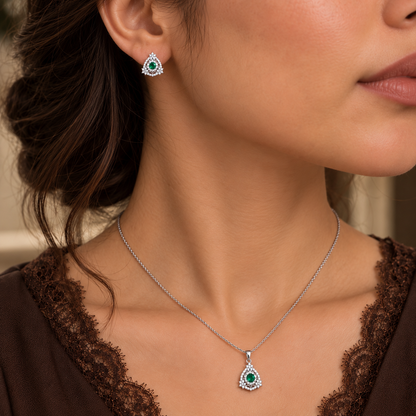 Model wearing petite S925 emerald-green zircon earrings and matching pendant necklace.