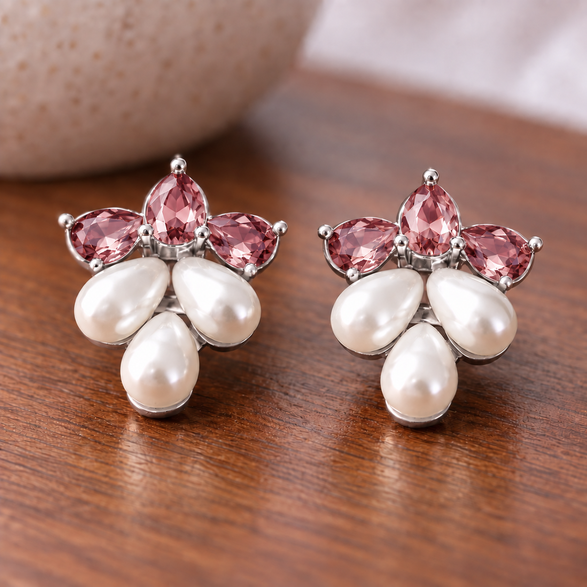Pair of Grape  Dew Pearl Studs featuring three faceted  ruby pink crystals above three ivory teardrop pearls in a silver-tone grape-bunch inspired design