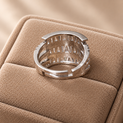Back view of the Tierline S925 sterling silver ring showing the wide band, open gallery construction and structured settings beneath the zircon rows
