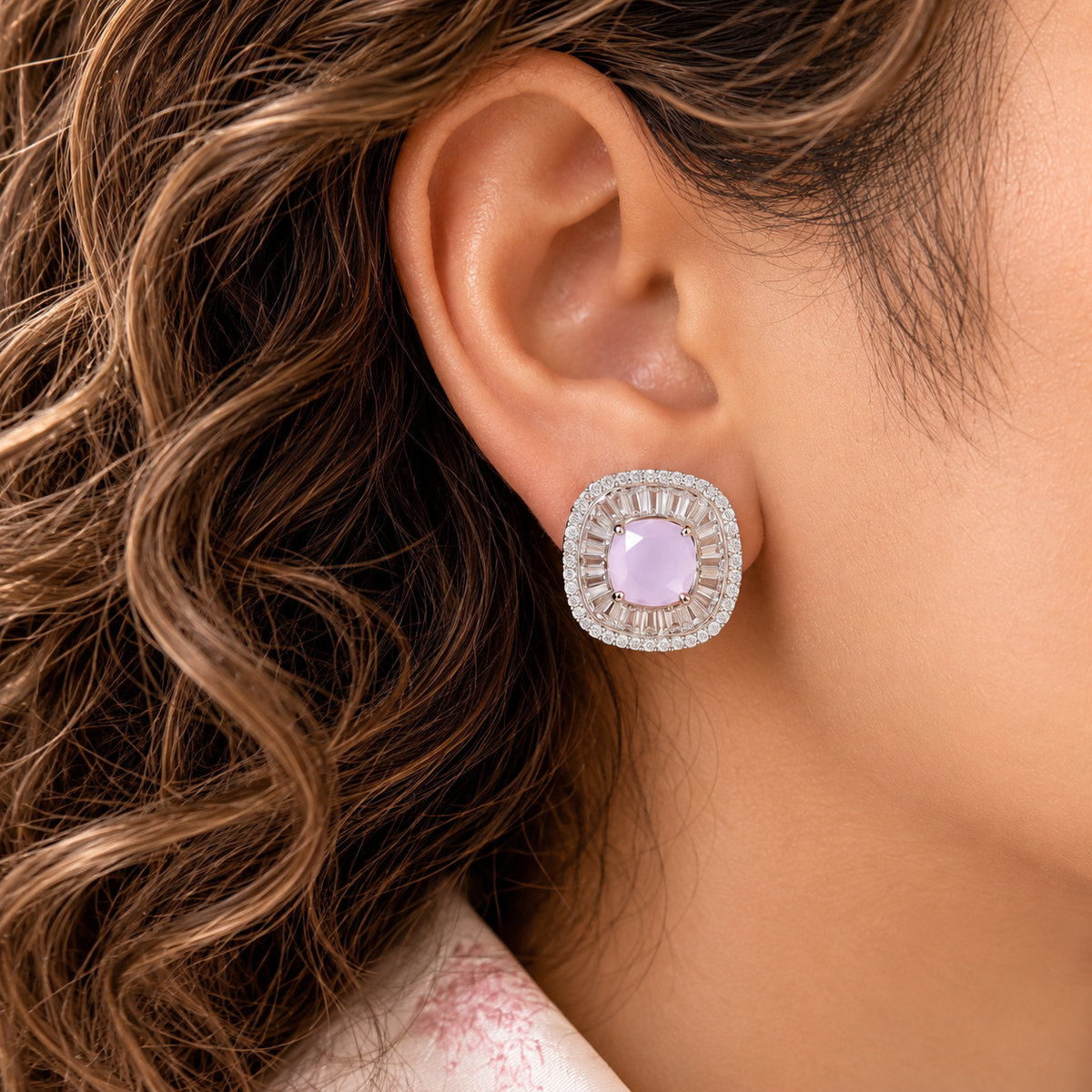 Model wearing Prism Court Stud with pink centre stone and polished silver-tone zircon setting