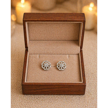 Silver circular crystal stud earrings displayed in premium velvet jewelry box