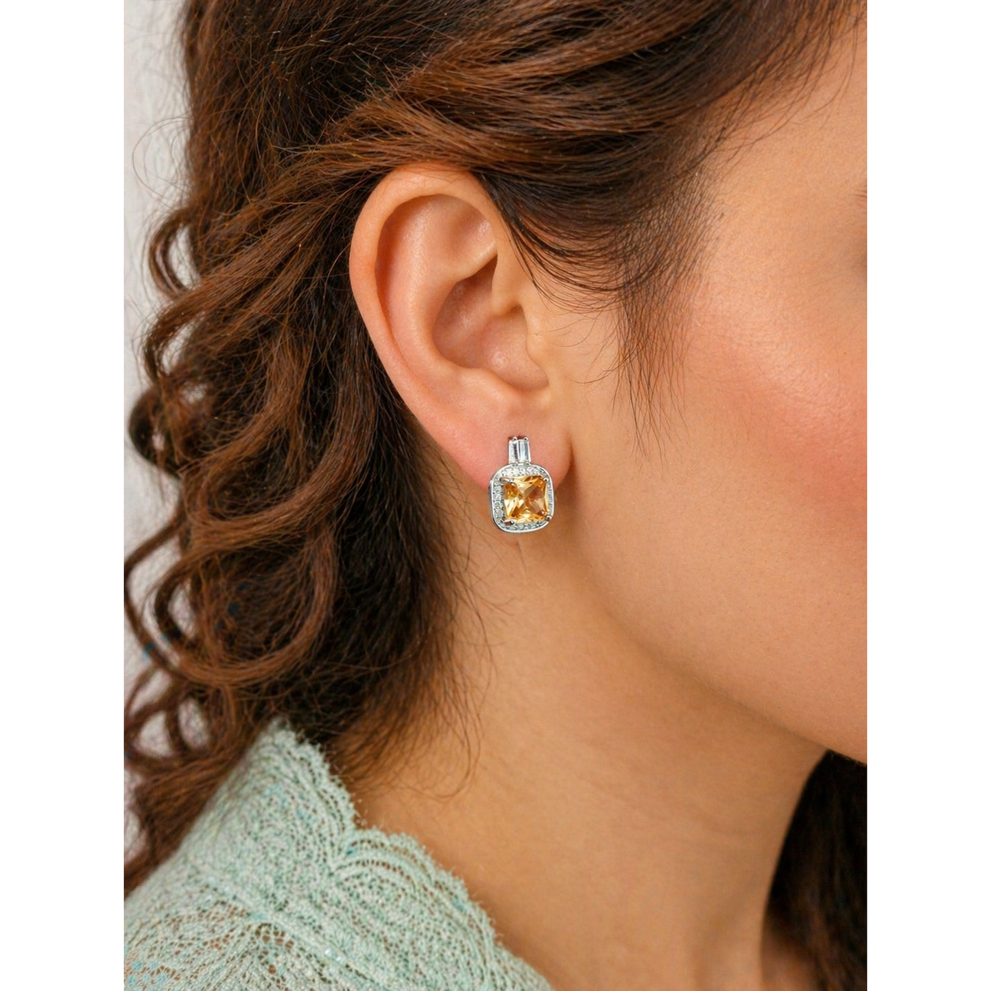 Square halo stud earrings with coloured gemstone worn on ear, silver tone crystal border elegant modern jewelry