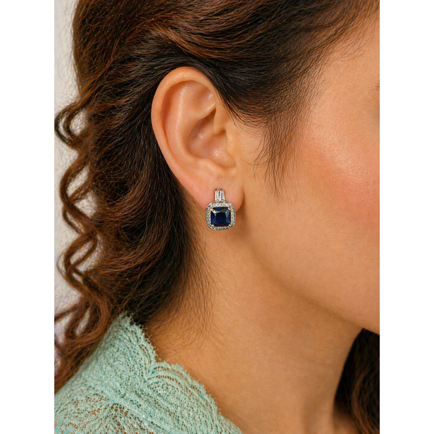 Square halo stud earrings with coloured gemstone worn on ear, silver tone crystal border elegant modern jewelry