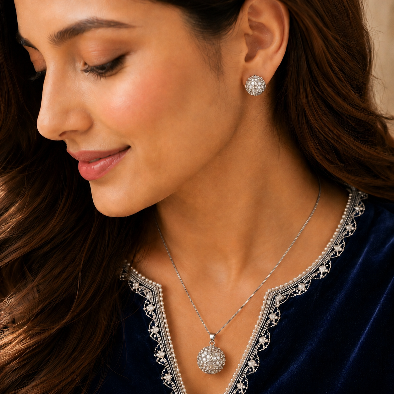 Model wearing the Lattice Dome Set with matching silver-tone dome stud earrings and lattice pendant necklace.