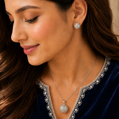 Model wearing the Lattice Dome Set with matching silver-tone dome stud earrings and lattice pendant necklace.