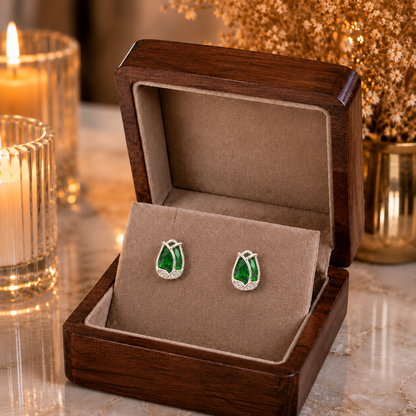 Tulip Emerald Green crystal stud earrings displayed in a premium velvet jewellery box with luxury wooden finish, candlelight ambience and dried floral décor