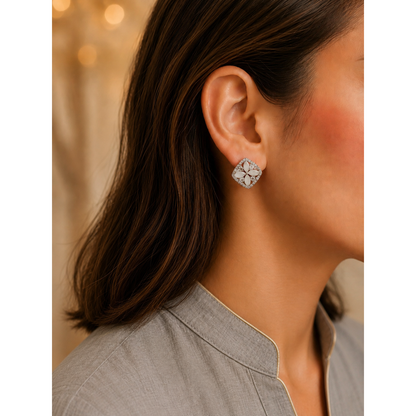 Close-up of a person wearing a diamond earring with a blurred background
