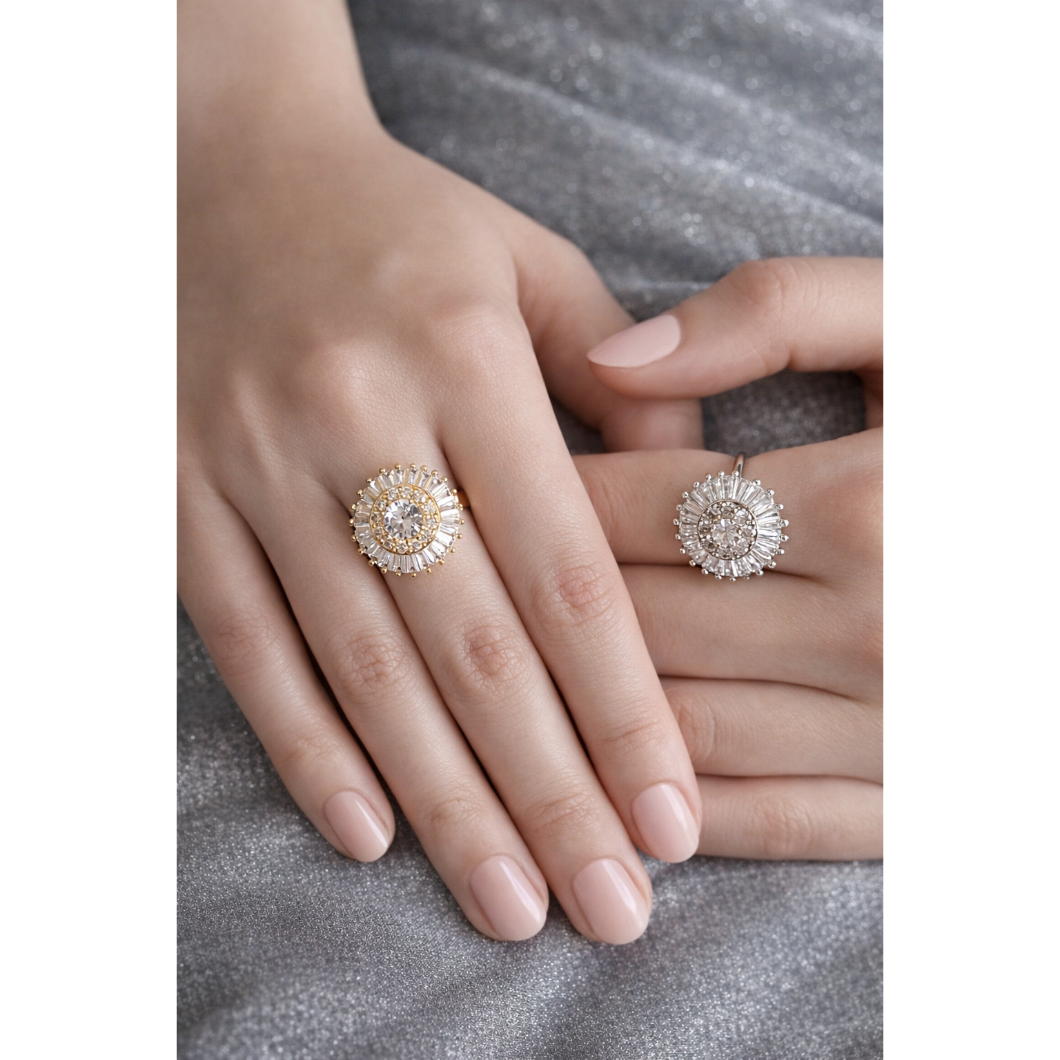 Gold and silver halo rings worn on model hands with sunburst baguette crystal design and central round stone halo ring style