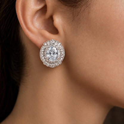 Close-up of Verdanza Oval Stud worn on the ear, featuring a clear oval centre stone surrounded by intricate clear zircon detailing.