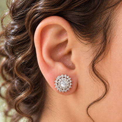 Close-up of a woman's ear wearing a clear Kensington Cluster Stud, showcasing its delicate circular design and neat placement on the earlobe.