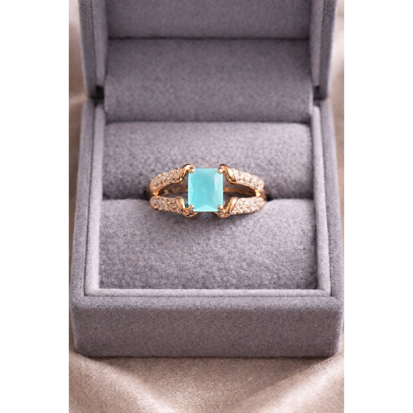 Gold aqua ring in a box