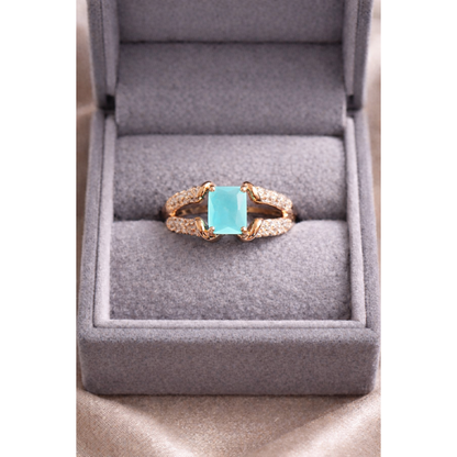 Gold aqua ring in a box