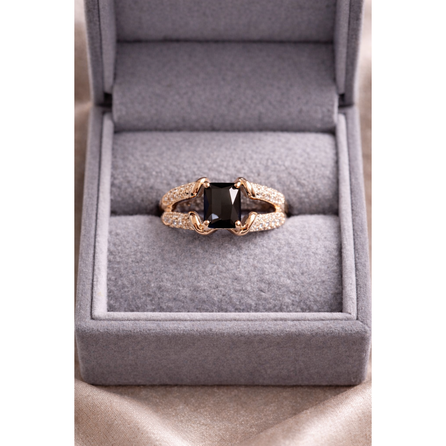 Gold black ring in a box