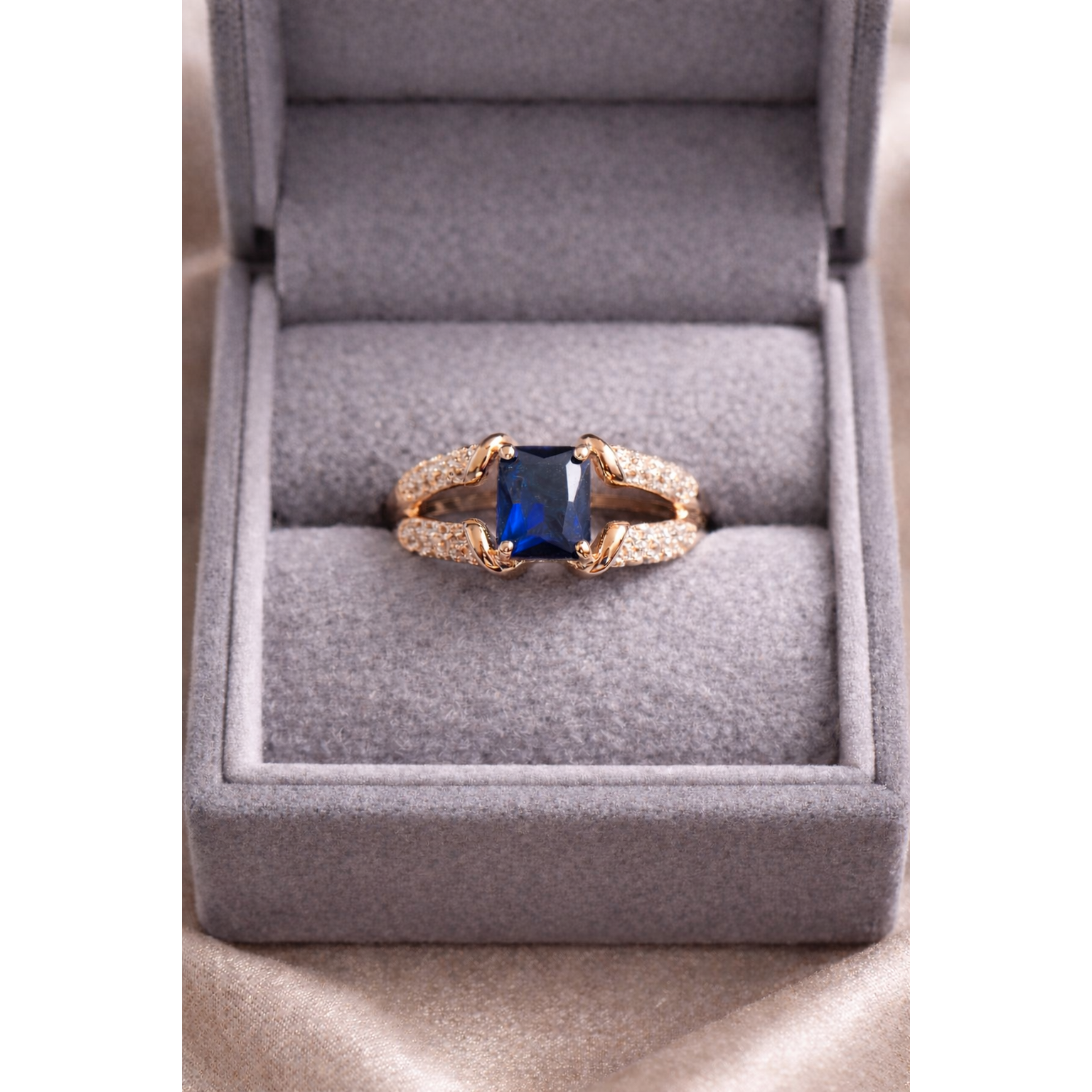 Gold blue ring in a box