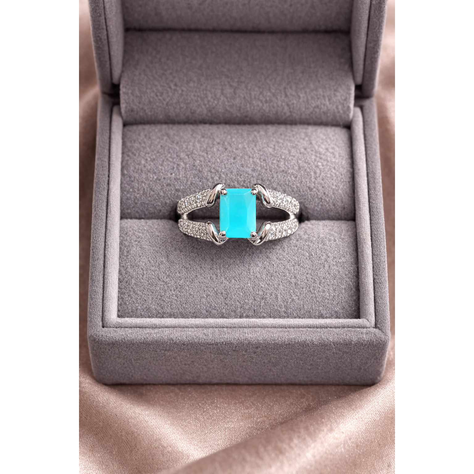Silver aqua ring in a box