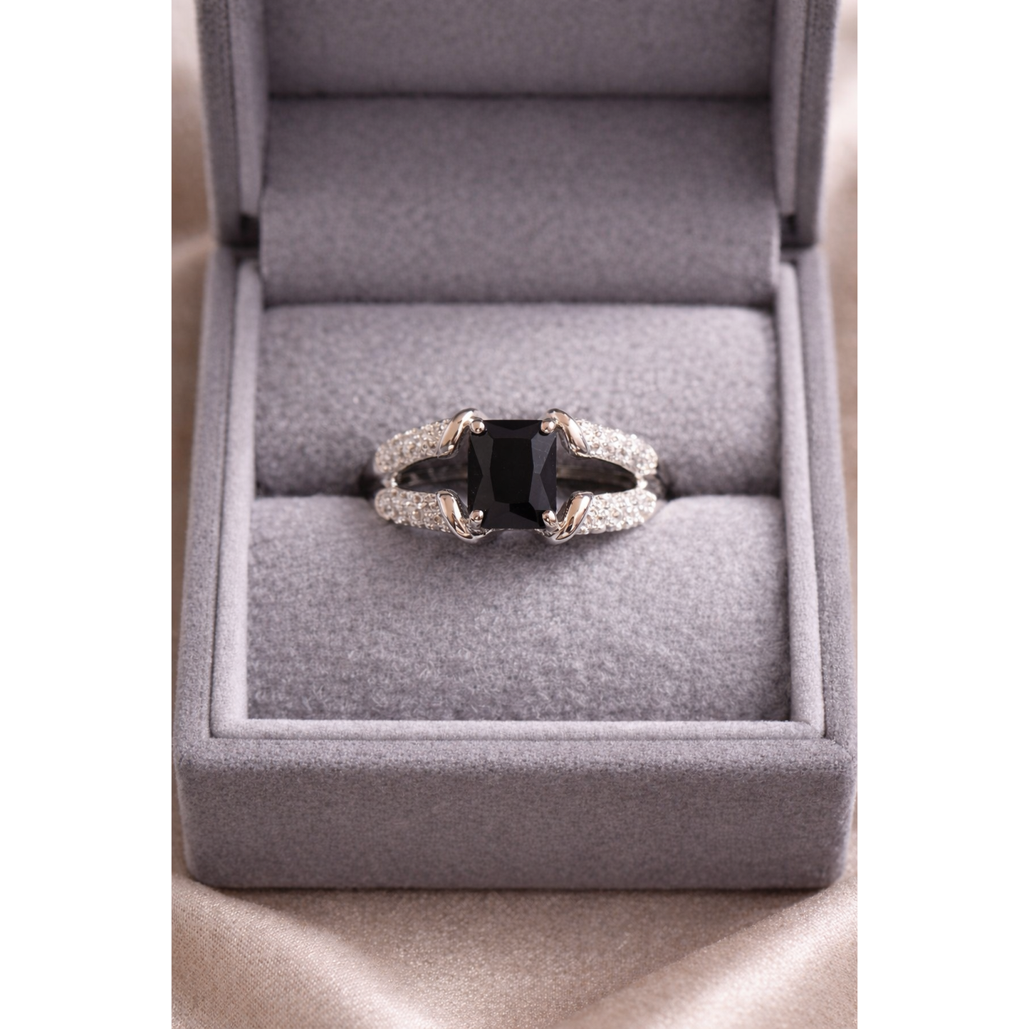 Silver black ring in a box