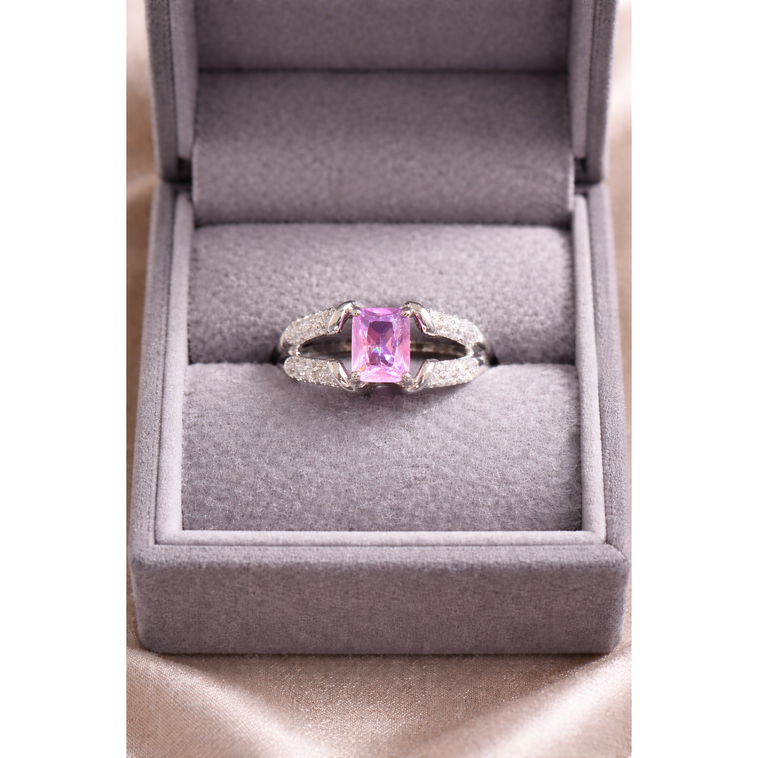 Silver pink ring in a box