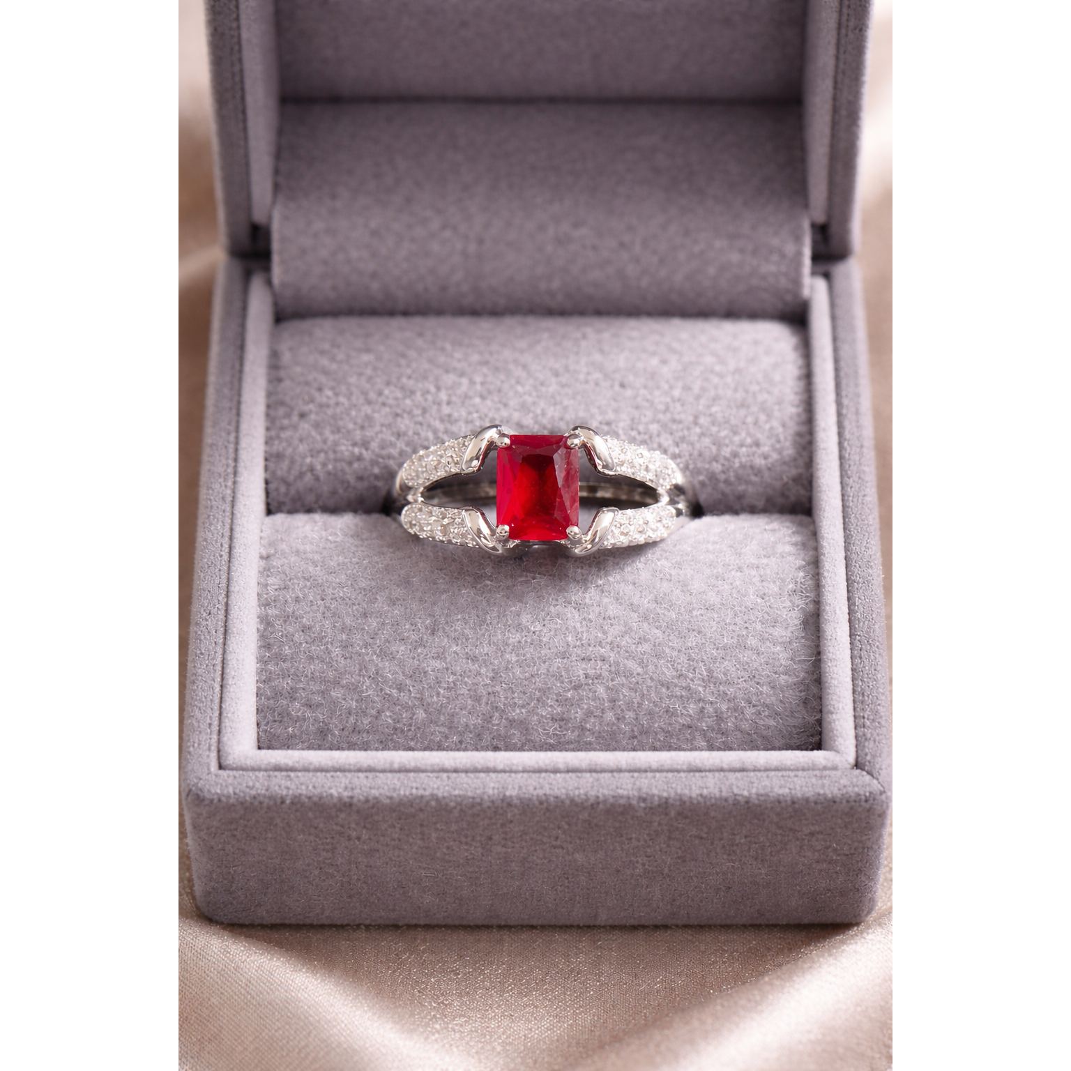 Silver red ring in a box