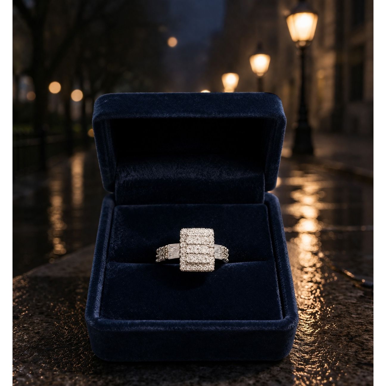 Adjustable crystal cluster ring placed in navy velvet jewelry box with night street lights background