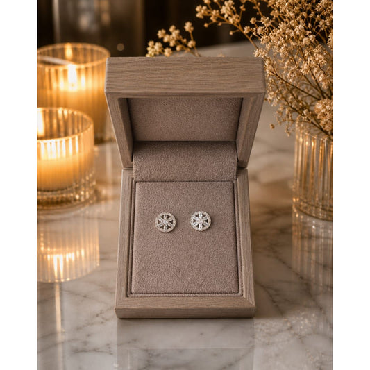 silver floral stone stud earrings displayed in a premium wooden jewelry box with taupe velvet lining