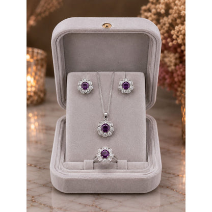 Champagne gold floral halo jewelry set displayed in a premium ivory velvet jewelry box featuring matching pendant, stud earrings, and ring.