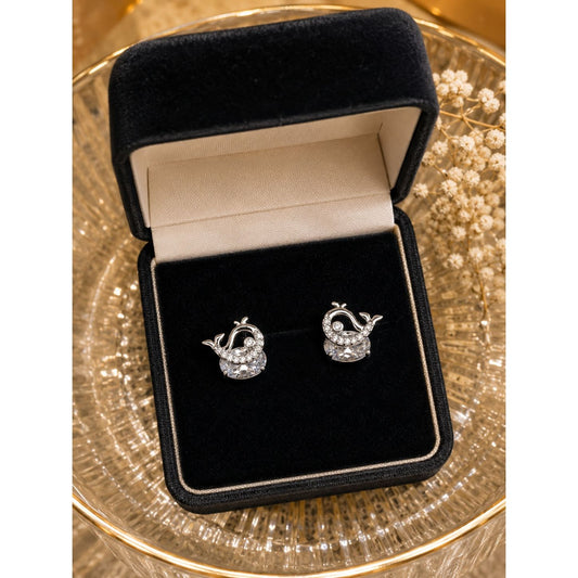 Silver whale stud earrings with cubic zirconia and round crystal displayed in a premium black velvet jewelry box.