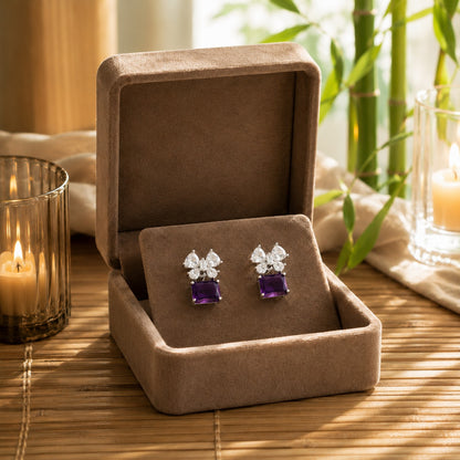 Royal purple floral crystal drop earrings showcased in a premium mocha velvet jewellery box