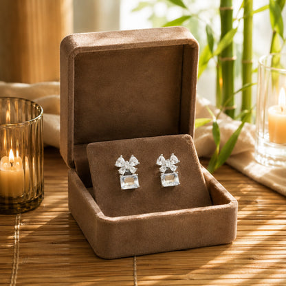 Crystal white floral crystal drop earrings displayed inside a premium mocha velvet jewellery box.