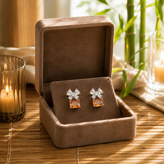Champagne floral crystal drop earrings presented in a premium mocha velvet jewellery box.